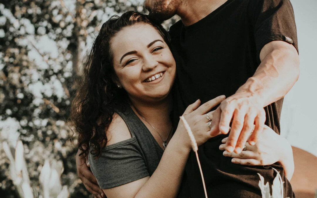 Happy couple who is embracing after investing in their relationship. Couples therapy or Marriage Counseling in Houston, Tx. Work with a relationship therapist to help you get on the right track and reconnect.